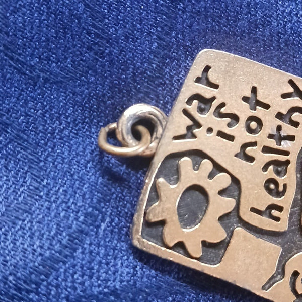 Vintage War Is Not Healthy Pendant.