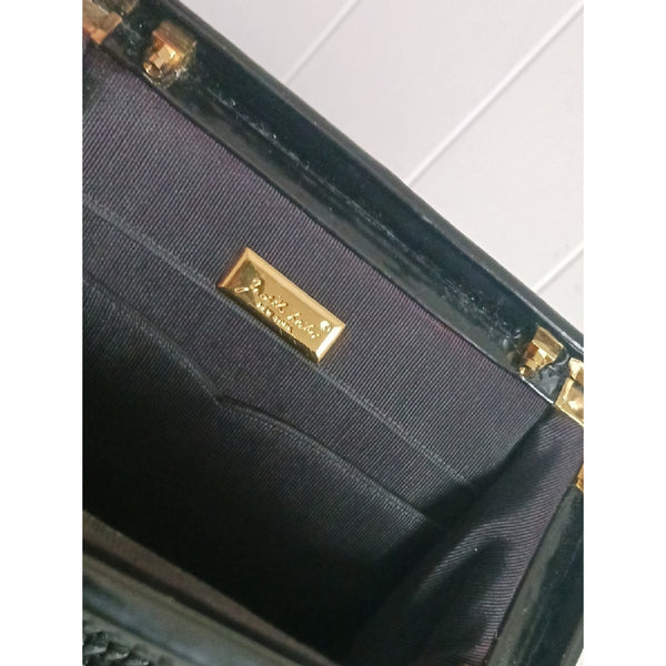 JUDITH LEIBER BLK TEXTURED AND PATENT BAG.
