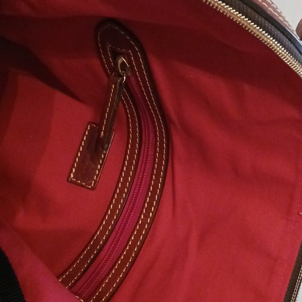 Dooney & Bourke Blue Canvas Tote With Leather Handles.
