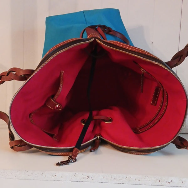 Dooney & Bourke Blue Canvas Tote With Leather Handles.