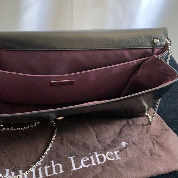 Judith Leiber black clutch with art decoration clasp
