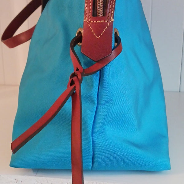 Dooney & Bourke Blue Canvas Tote With Leather Handles.