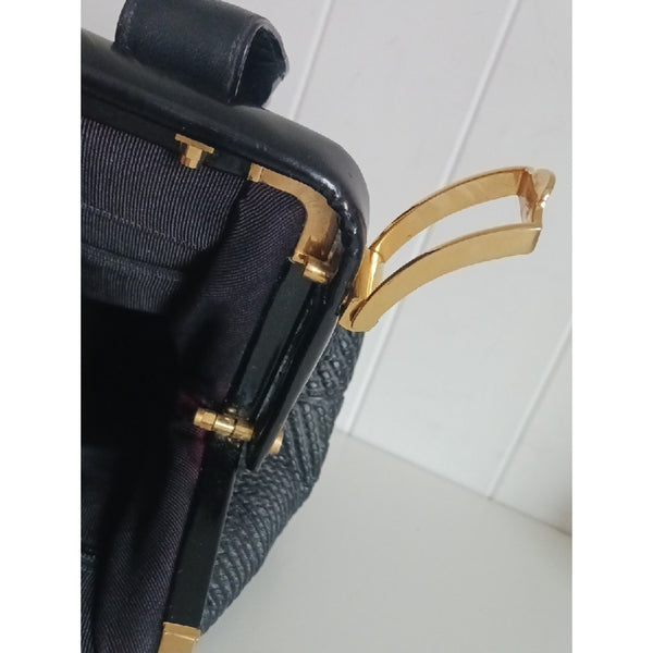 JUDITH LEIBER BLK TEXTURED AND PATENT BAG.
