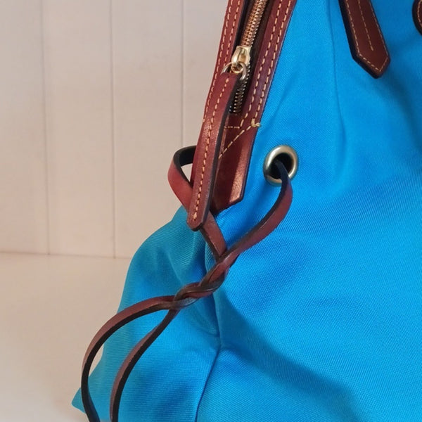 Dooney & Bourke Blue Canvas Tote With Leather Handles.