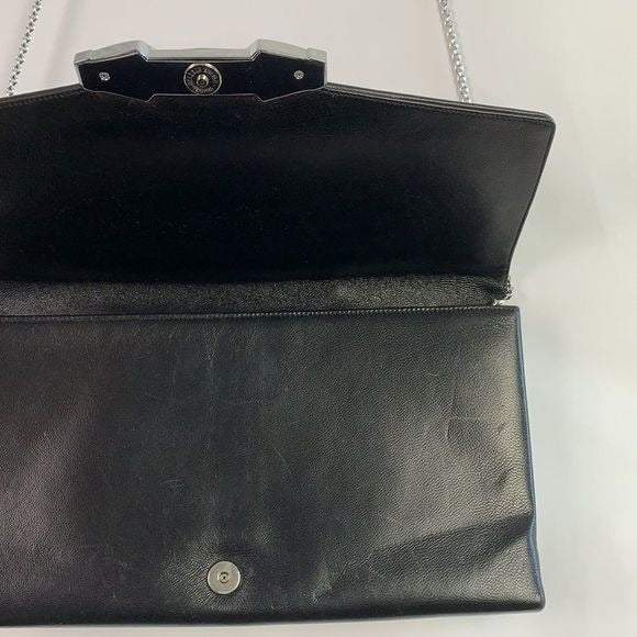 Judith Leiber black clutch with art decoration clasp