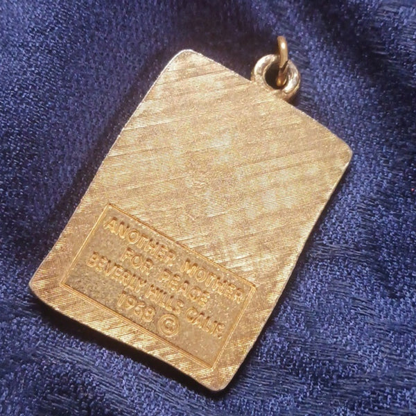 Vintage War Is Not Healthy Pendant.