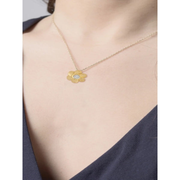 REISS  HAMMERED DAISY PENDANT.