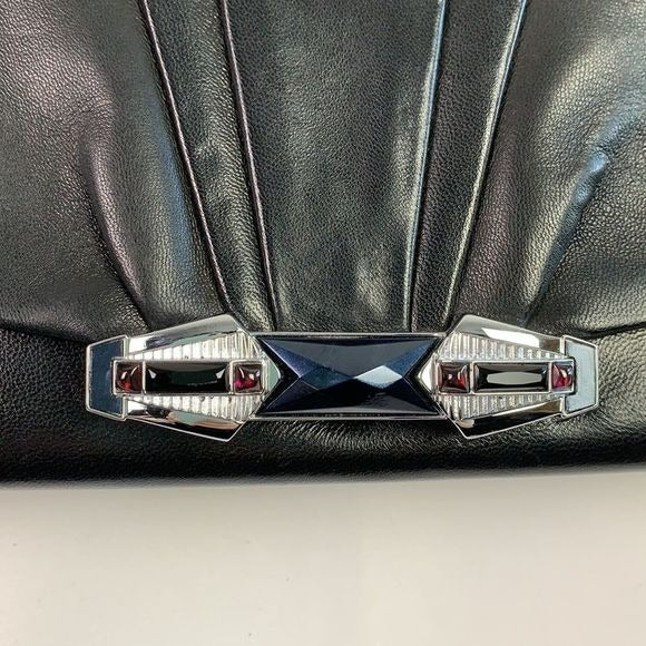Judith Leiber black clutch with art decoration clasp